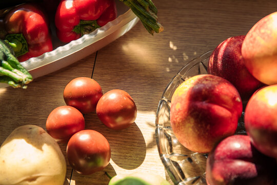 Fresh fruits and vegetables on table at kitchen