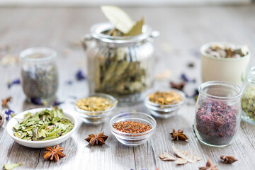 Spices and herbs in jar and bowl