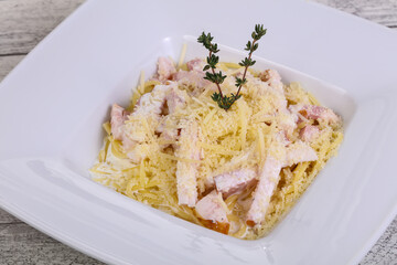 Pasta carbonara with ham and cheese