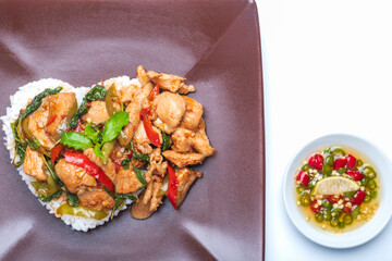 Stir fried chicken with basil over rice