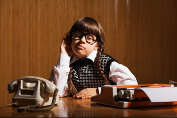 Little girl runs a business. She is eavesdropping. Business concept.