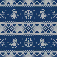 Knitted seamless pattern with penguins and snowflakes. Sweater background.