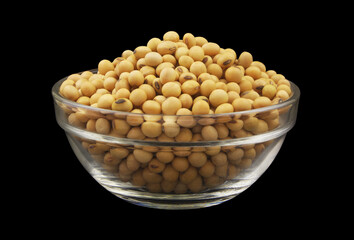 Soy beans in glass bowl isolated on black background	