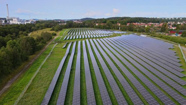 Solar Station On Agriculture, Solar Power Plants, Solar Panels Farm In Utby, Gothenburg, Sweden - aerial drone shot