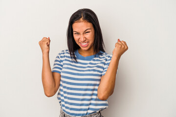 Young latin woman isolated on white background  upset screaming with tense hands.