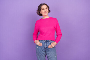 Photo of attractive senior woman happy positive smile confident look empty space isolated over purple color background