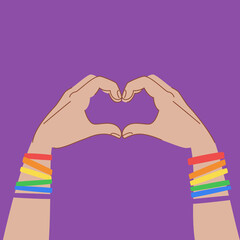 Hands in Heart sign isolated on purple background. Hands with bracelets in LGBT flag colors. LGBT poster design. Two hands form a heart gesture. - 459418928