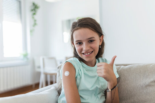 Adhesive bandage on arm after injection vaccine or medicine,ADHESIVE BANDAGES PLASTER - Medical Equipment,Soft focus Adhesive bandage on a female brachium after covid-19 vaccination