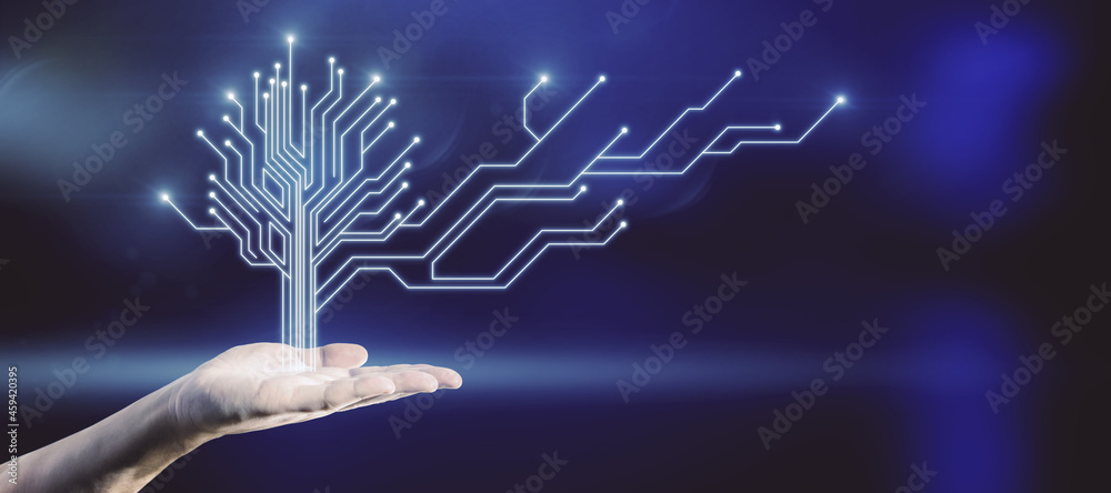 Aufkleber Close up of hand holding abstract digital circuit tree on blurry blue background with mock up place. Information, technology and business concept.