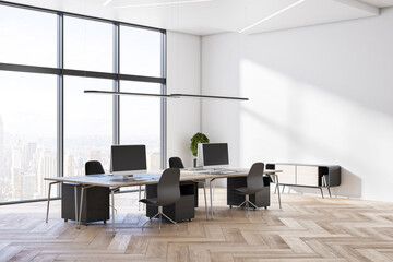Minimalistic wooden and concrete coworking office interior with equipment, furniture, different objects, city view and sunlight. 3D Rendering.