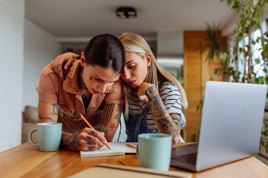 Lesbian Women Working Together At Home