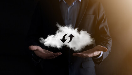 Cloud technology. Polygonal wireframe cloud storage sign with two arrows up and down on dark ....
