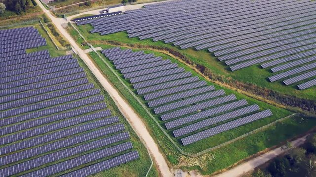 Solar Panels Farm Field Of Green Renewable Energy In Utby, Gothenburg, Sweden - aerial drone shot