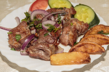 Pieces of fried lamb on the dish.