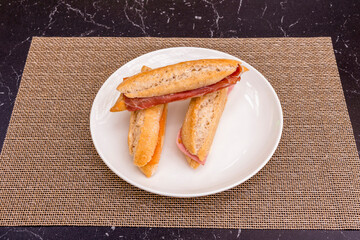 small sandwiches, piccolos, of various flavors. Norwegian salmon, ham and cheese and Iberian ham