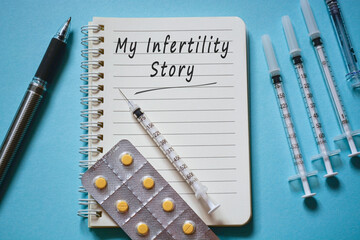 My infertility story text on white notepad with disposable injection syringes