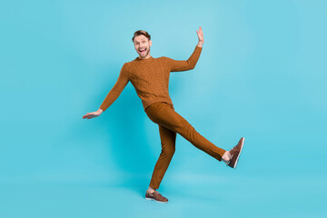Fototapeta premium Full size photo of happy funny cheerful man dance funky good mood positive guy isolated on blue color background