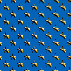 Seamless pattern of bananas on a uniform blue background.