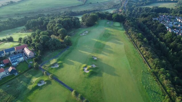 Sunrise over Ramside Golf Course in County Durham - Aerial Drone 4K HD Footage Fly Backwards