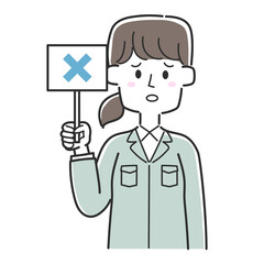 バツの書かれた札を持っている工務店の社員