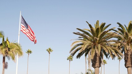 Palms and american flag, Los Angeles, California USA. Summertime aesthetic of Santa Monica Venice...
