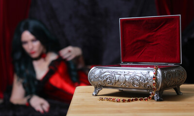 Jewelry Box with Woman in Corset in background, Shallow DOF, Focus on Jewelry Box