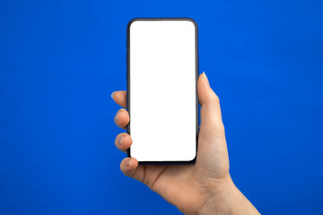 Mobile phone mockup screen on a blue background, copy space photo