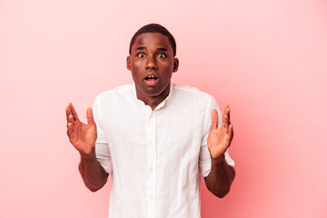 Young African American man isolated on pink background having an idea, inspiration concept.