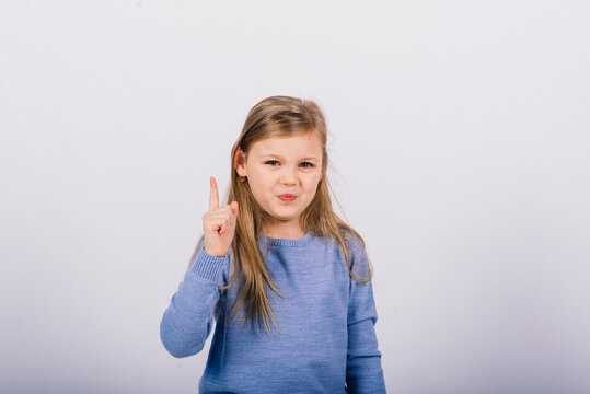 Portrait of beautiful little girl happy smiling on studio. Isolated white background