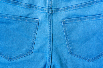 Close-up view of blue jeans - back view pockets