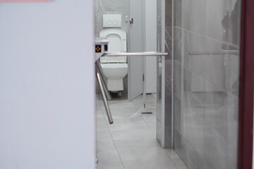 a city toilet room and a control turnstile for entry and exit. selective focus