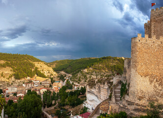 Obraz premium Castle and town of Alcala del Jucar, castilia la Mancha, Spain, lying in a gorge of the Jucar river