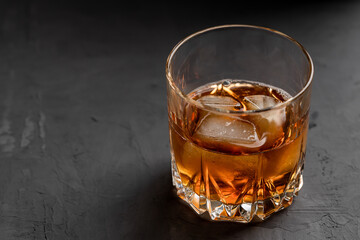 whiskey glass on a concrete background with copy space. alcohol addiction concept