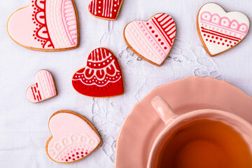 Studio shot of cup of tea and heart shaped cookies
