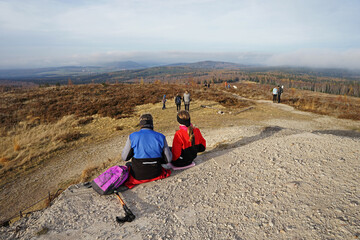 Fototapeta premium Hikers relaxing on the top of the Jordan hill, former military area in Brdy, Czech Republic