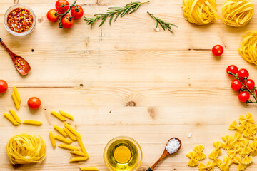 Pasta ingredients with tomatoes olive oil spices and herbs