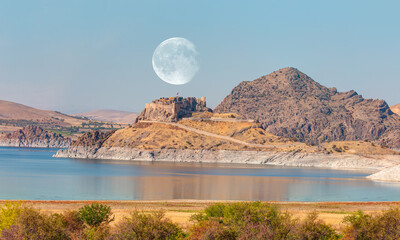 Pertek castle located in Pertek district of Tunceli - Pertek, Turkey Keban dam lake in the foreground "Elements of this image furnished by NASA " © muratart