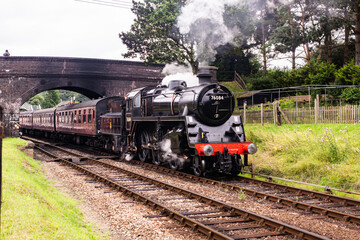 Fototapeta na wymiar BR Standard 4 – 76084 pulling a rake of carriages