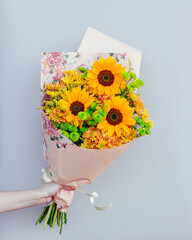 yellow bouquet on gray background