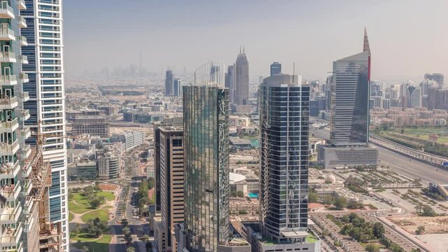 Aerial view of media city and al barsha heights district area all day timelapse from Dubai marina.