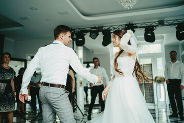 The bride and groom are dancing. Waltz, the bride and groom's dance