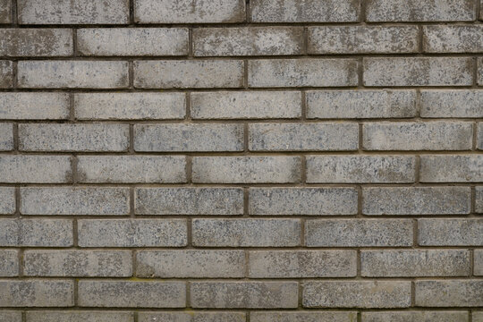 Pattern of grey wall made of concrete bricks