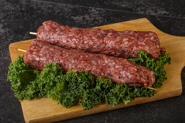 Raw minced beef kebab skewer