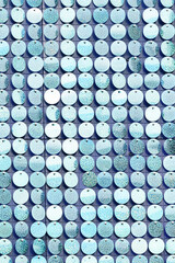 the wall is made of round blue sequins. Decoration and decoration of interiors.