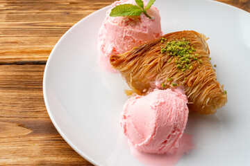 Close up photo of Turkish baklava served with ice cream