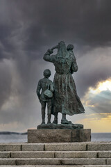 Statue of the wife of a sailor looking out at sea