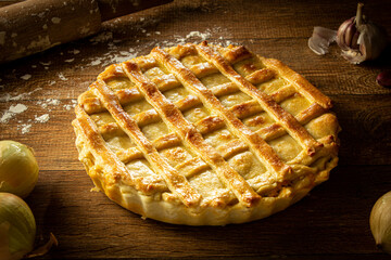 Brazilian Chicken Pie -  Homemade Chicken Pie on Spatula on a Wooden Table Rustic Appeal