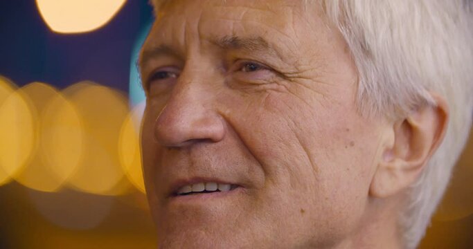 Bokeh Close Up Shot Of Senior Gray Haired Man Looking Away