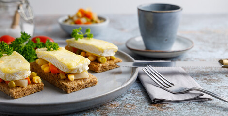 Toast with vegetables and grilled cheese. Toast with vegetables and French cheese gratin.