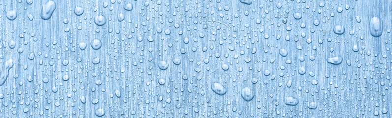 Water drops on metal, blue background. May used as background